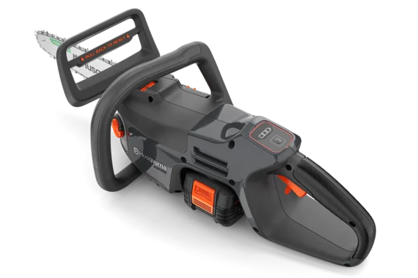 Close-up of the Husqvarna Aspire C15X-P4A6 cordless chainsaw showing ergonomic grip, safety guard, and battery pack.