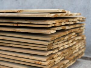 Stacked dressed timber fence capping boards for outdoor fencing and garden finishing