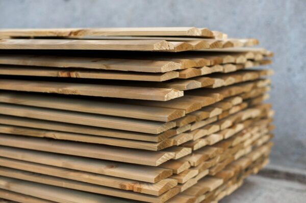 Stacked dressed timber fence capping boards for outdoor fencing and garden finishing