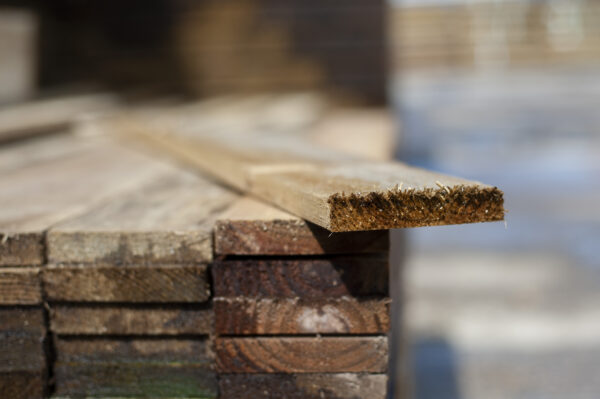 Close-up of stacked timber fence slats for garden, privacy, and boundary fencing